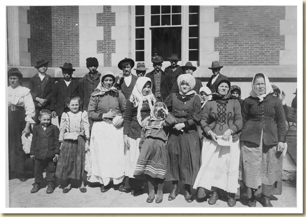 Photograph, Immigrants Outside a Building on Ellis Island, early 20th century