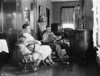 historical image of family listening to the radio