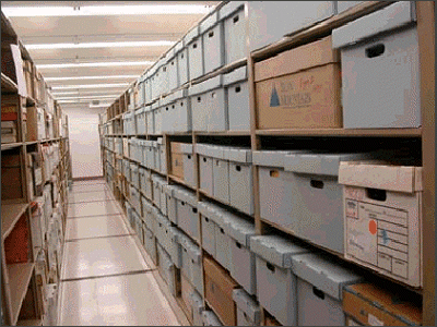 Shelves with boxes of files from the Hampton Collection