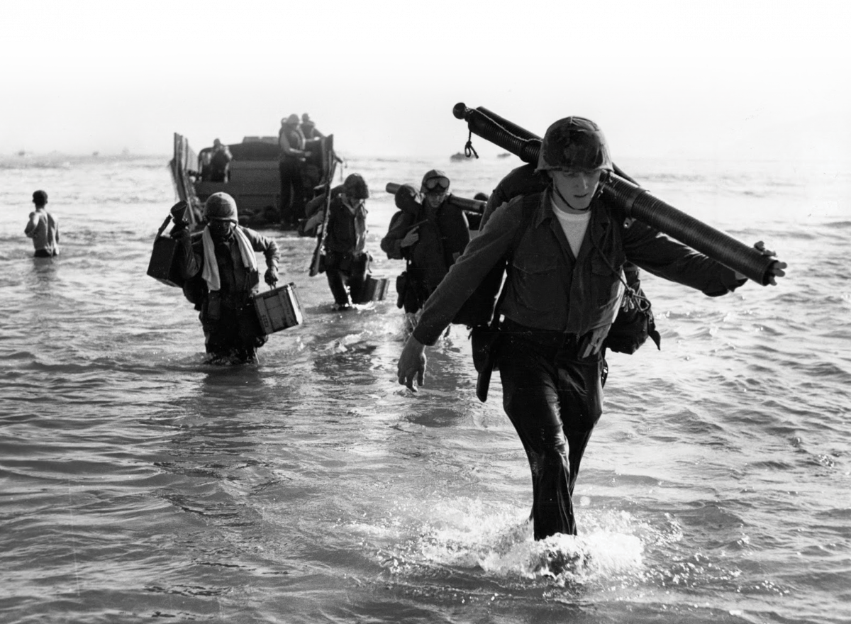 Marines come ashore near Da Nang Marines come ashore near Da Nang Air Base on March 8, 1965. Vietnamese officials only learned of plans to introduce American ground troops as 3,500 Marines were wading onto its shores. (National Archives, RG 127)
