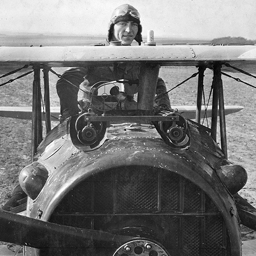Eddie Rickenbacker standing up in his Spad plane, France, 1918