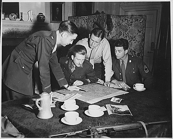 Jedburghs get instructions from Briefing Officer in London flat. england, circa 1944 (National Archives Identifier 540064)