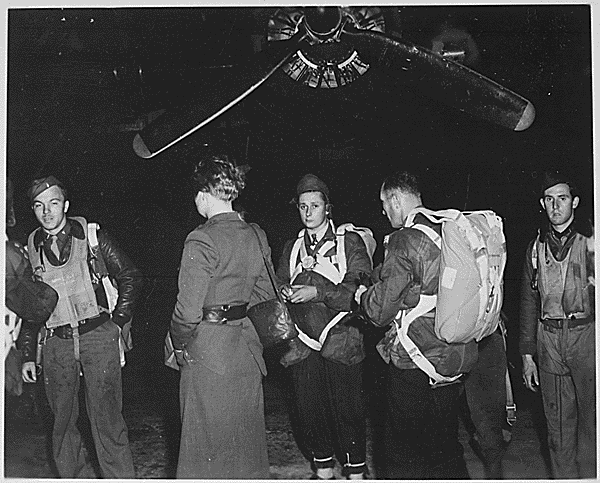 Jedburghs in front of B-24 just before night takeoff. Area T, Harrington Airdrome, England, circa 1944 (National Archives Identifier 540066)