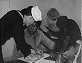 Filling out forms for enlistment in the Navy, ca. 1940, National Archives Identifier: 285826