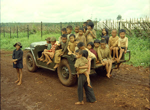Photograph of Children Sitting in a Special Forces Jeep