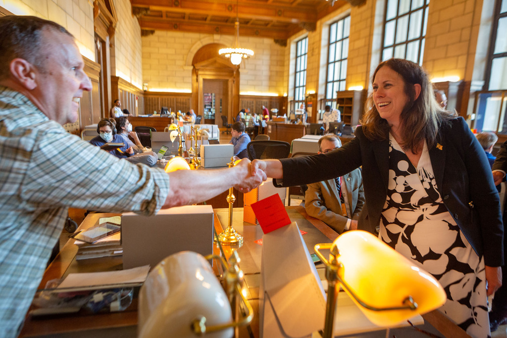 Archivist Colleen Shogan greets a research at Archives I