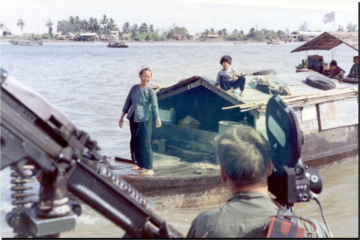 Vietnam combat motion picture photographer at work