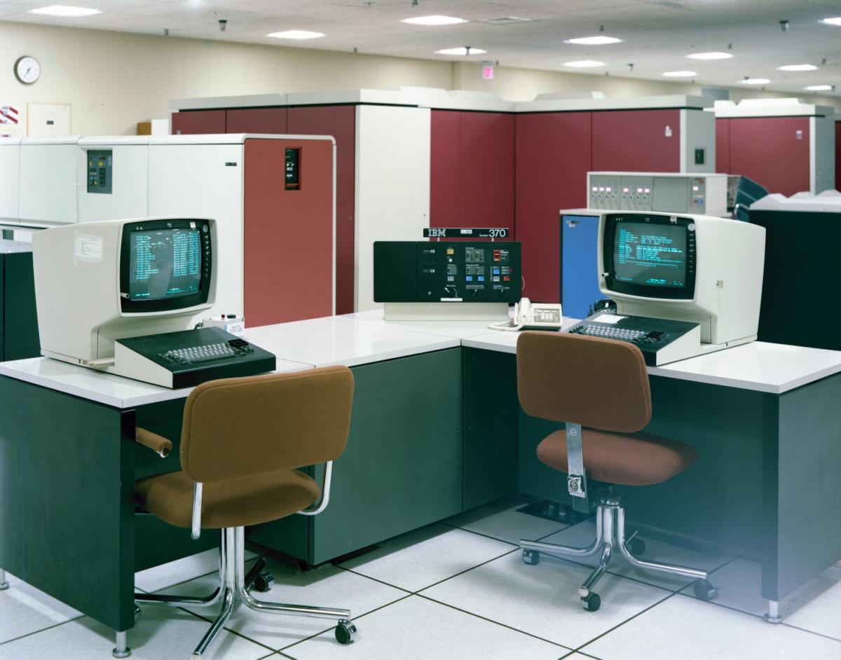 Color photograph of an empty room with computers