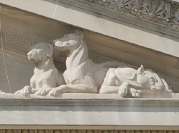 Detail of Archives Building pediment showing two dogs