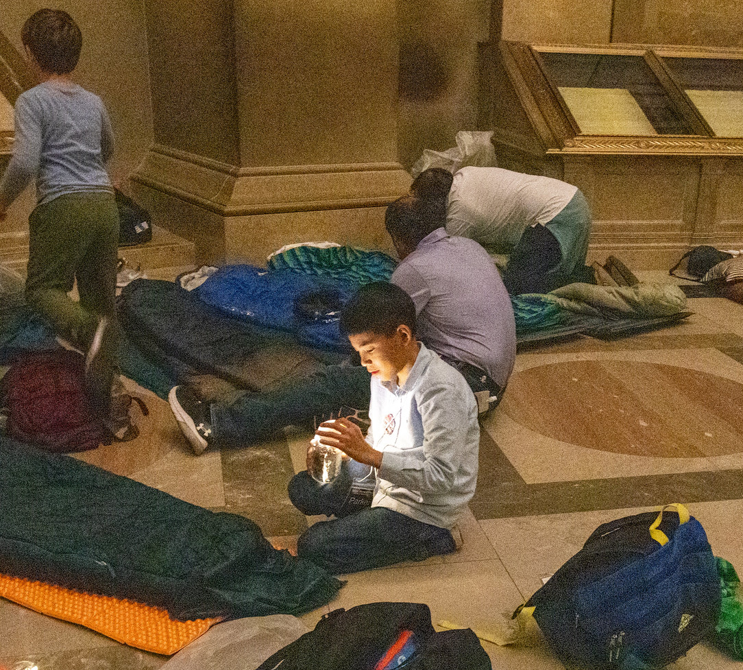 children get ready to sleep in the Rotunda during the National Archives Sleepover Oct 19 2024