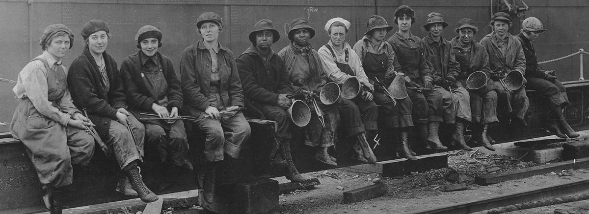 Women rivet heaters line up for a photograph at Puget Sound Navy Yard during World War I