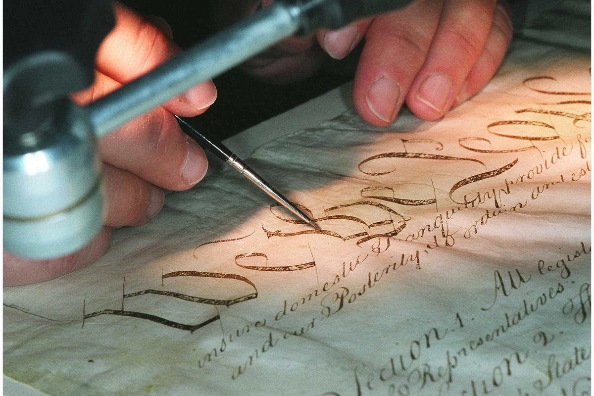 A conservator works on the US Constitution in 2002