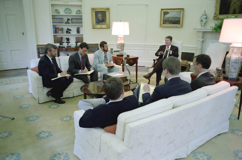 White House speechwriters meet with President Reagan in the Oval Office on May 18, 1987. 