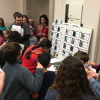 National Archives Sleepover participants gather around “Mission Control” as they complete their first challenge activity of the evening—collecting and matching astronaut trading cards—at the National Archives Sleepover on February 24-25, 2018